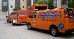 Fire Damage Restoration Vehicles On Job Location